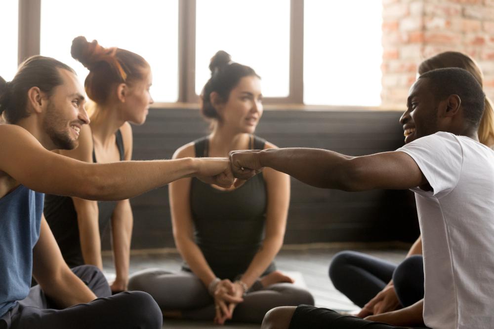 Smiling,Sporty,Fit,African,American,And,Caucasian,Men,Fist,Bumping